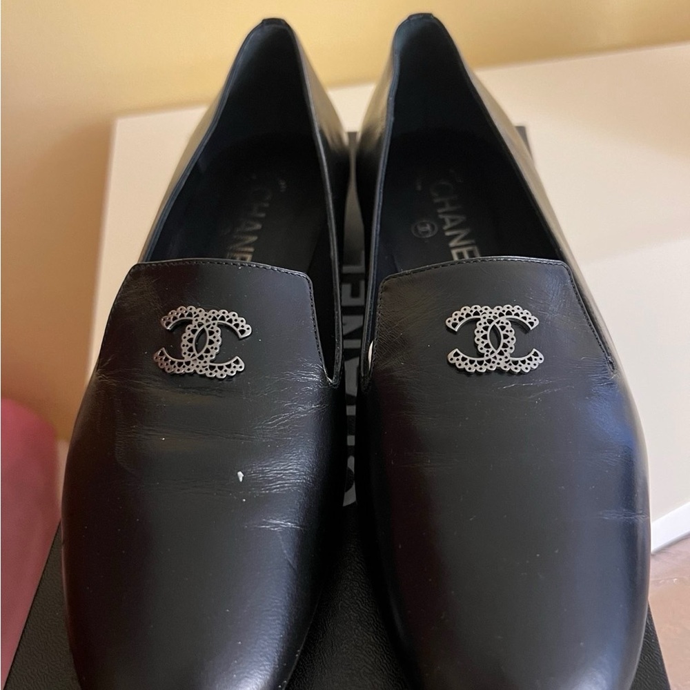 CHANEL Black Leather Loafers with Silver Logo